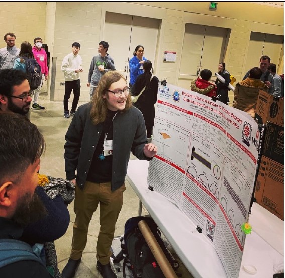 Undergraduate researcher presenting a Wolfram Demonstrations poster at the Joint Mathematics Meetings